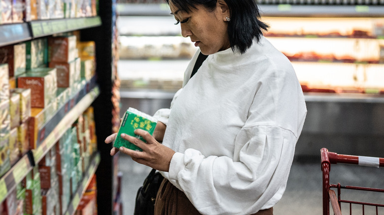 woman browsing the tea section 