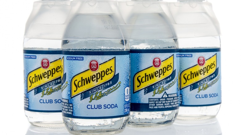 Bottles of Schweppes club soda
