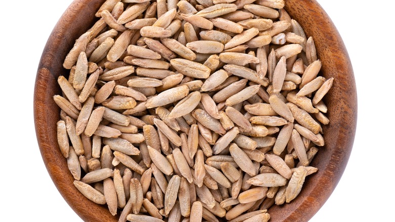 Rye grains in wooden bowl