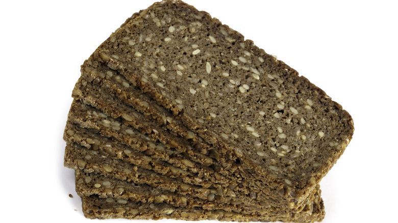 Thin slices on rye bread on white background