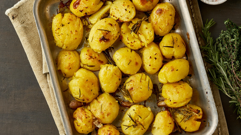 Roast potatoes in baking tray
