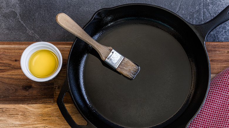 Cast iron pan with brush