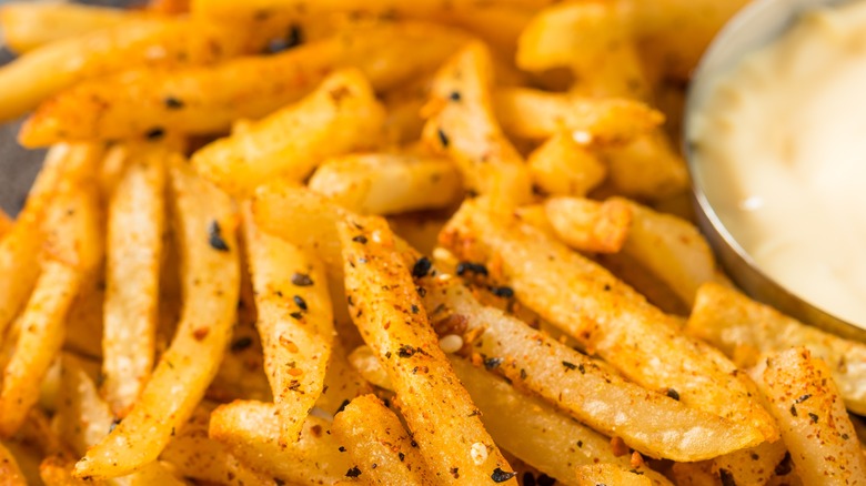 sprinkle of lemon pepper seasoning on fries