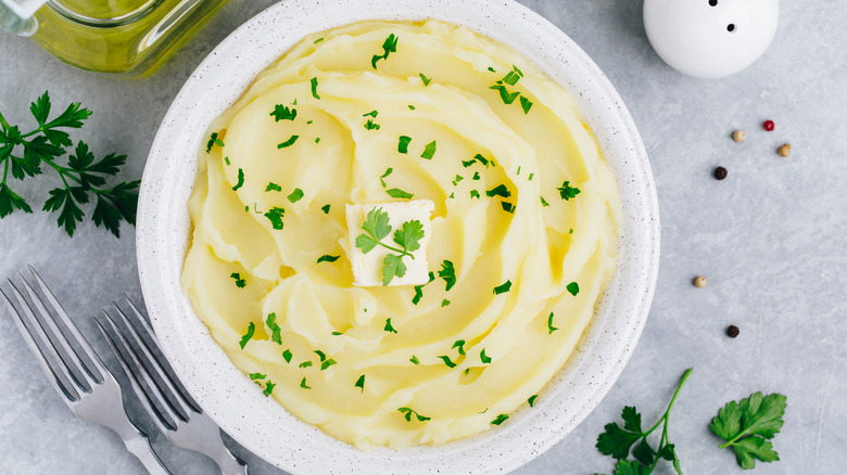 Bowl of mashed potatoes with butter