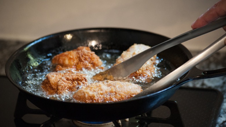 frying chicken in a pan