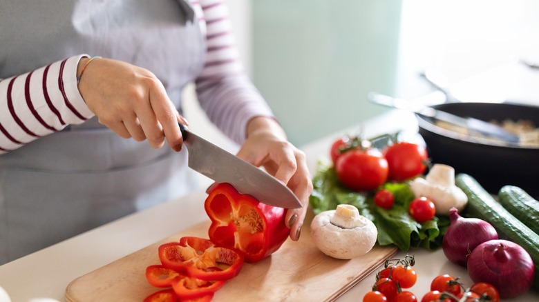 Woman preparing vegetables for meal