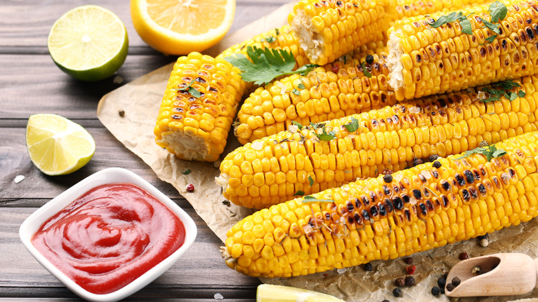 seasoned grilled corn with lemon, lime and ketchup