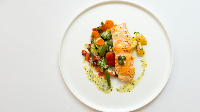 white plate with salmon fillet