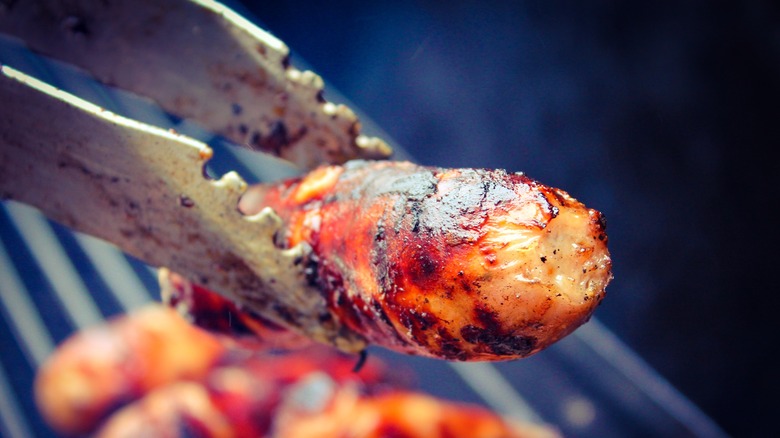 person flipping food with tongs