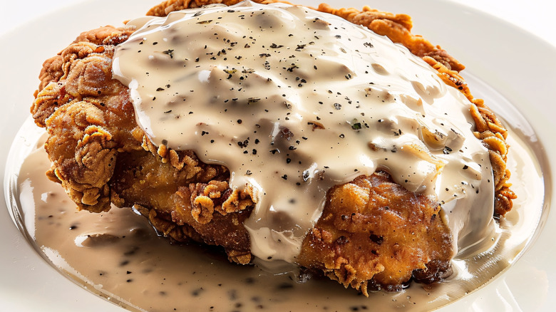 Chicken fried steak with pepper gravy on top