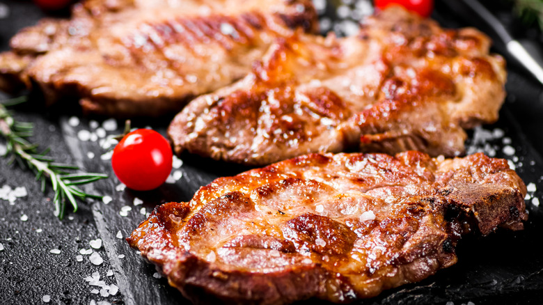 Pork steaks on a slate