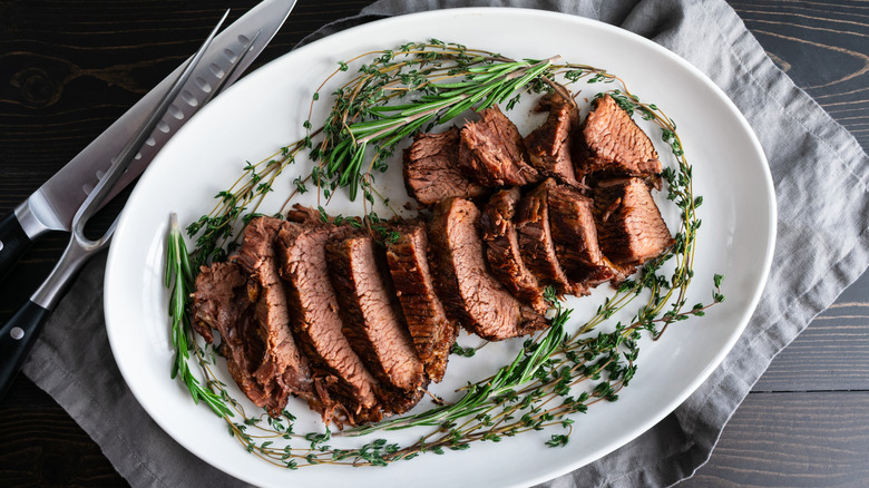 Tri-tip steak, sliced on a ceramic plate