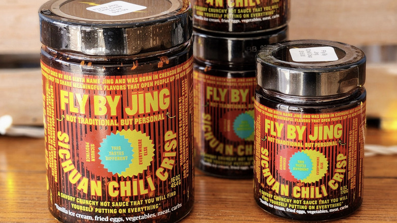 Jars of Fly by Jing Sichuan Chili Crisp stacked together