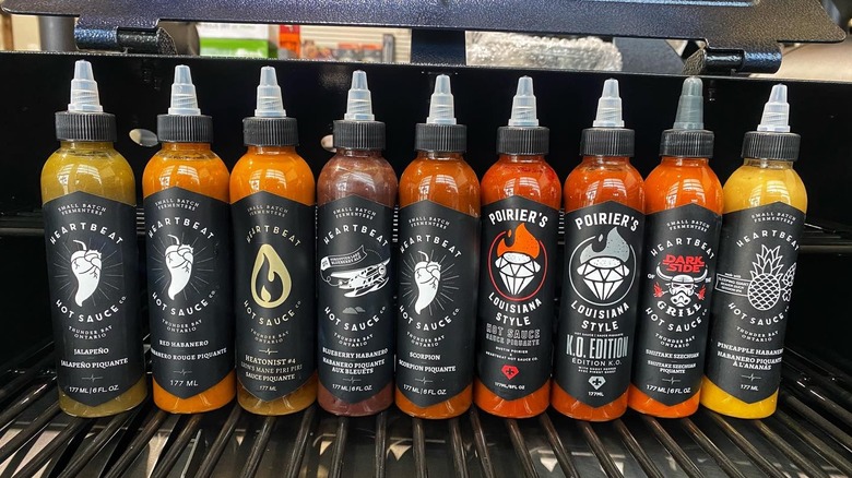 Heartbeat Hot Sauces lined up on grill 