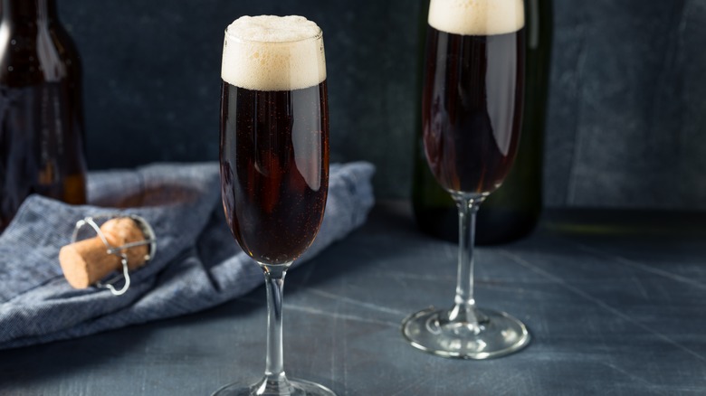 flutes of champagne with dark beer