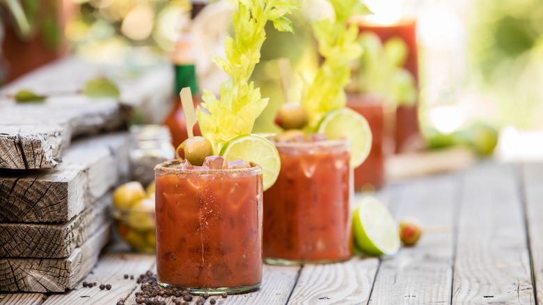 two bloody marys on wood table