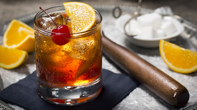 old fashioned with muddler and fruit