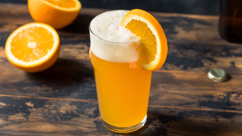 unfiltered wheat beer with orange slice