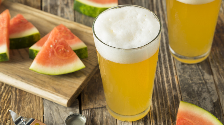 pint of beer with watermelon slices