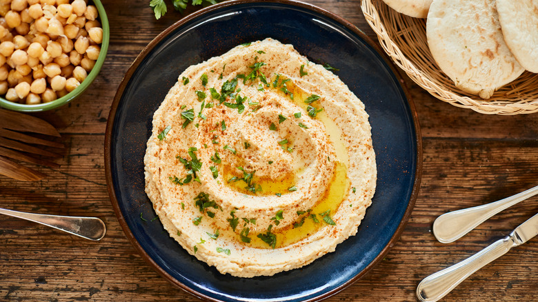 hummus in bowl with vegetables 