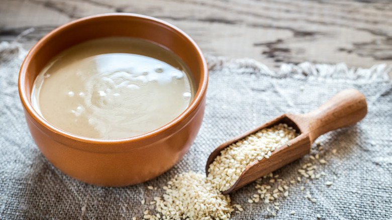 tahini in bowl with sesame seeds