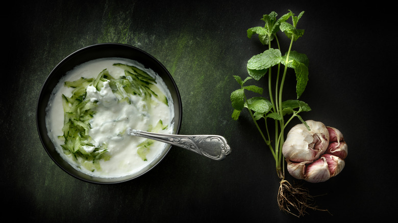 Tzatziki sauce in black bowl