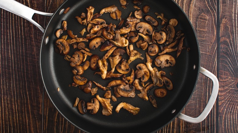 Sliced mushroom in frying pan