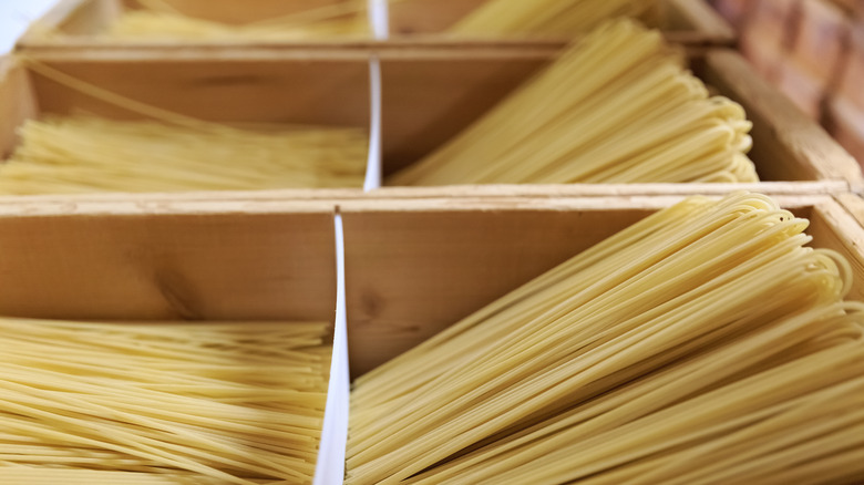 Wooden boxes of dry spaghetti