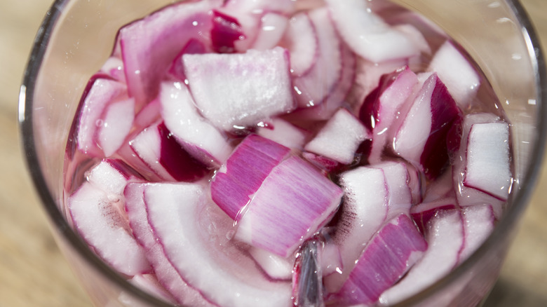 onions in water filled bowl