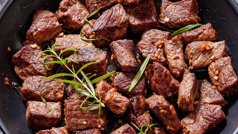 browned meat in skillet