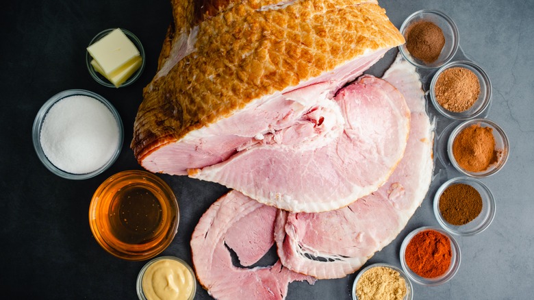 ham with glaze ingredients around the slices