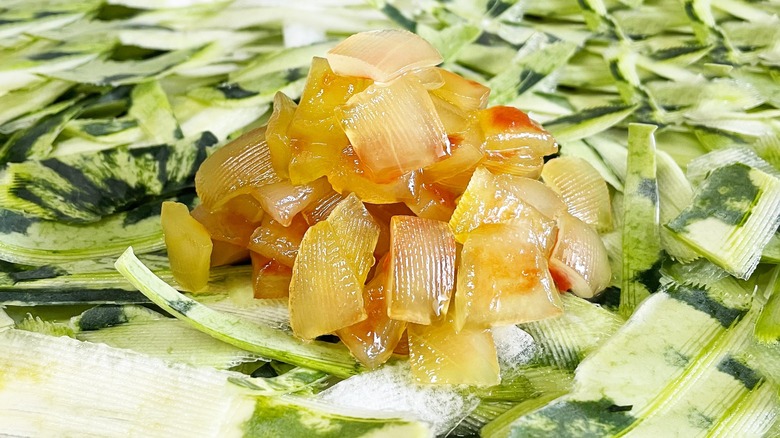 pile of watermelon rind candy on pile of green peel