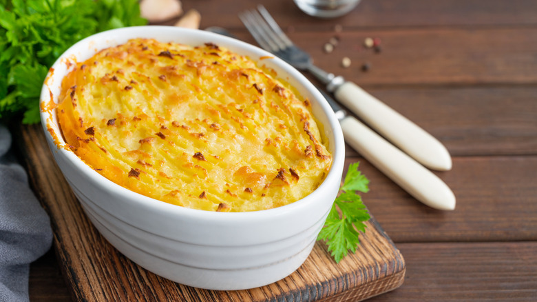 baked cheesy mashed potatoes, cooling to serve