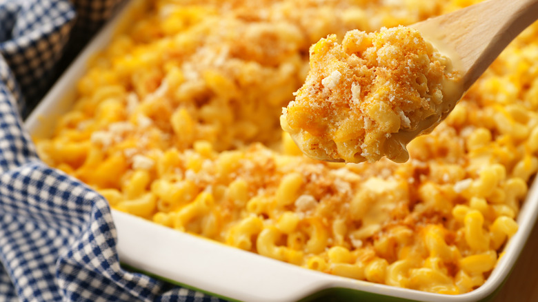 serving mac and cheese from casserole bowl