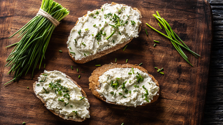 slices of bread topped with cottage cheese and herbs