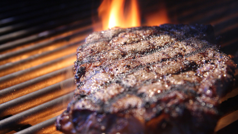 Ribeye steak on flame grill