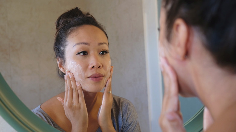 person washing face