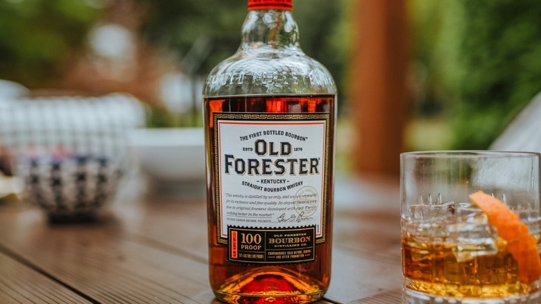 old forester whiskey bottle and barrel