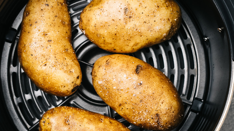 Baked potatoes in air fryer basket