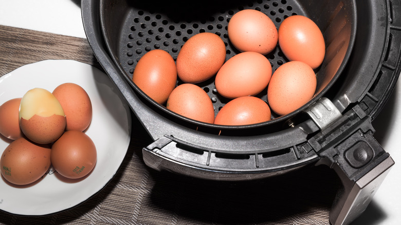 Air fryer basket full of hard boiled eggs