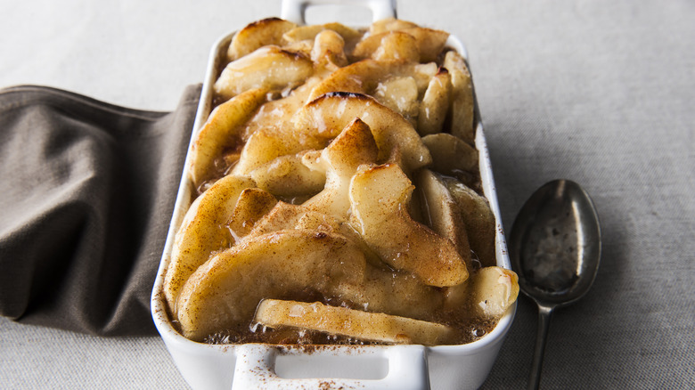 Dish of baked apples with cinnamon