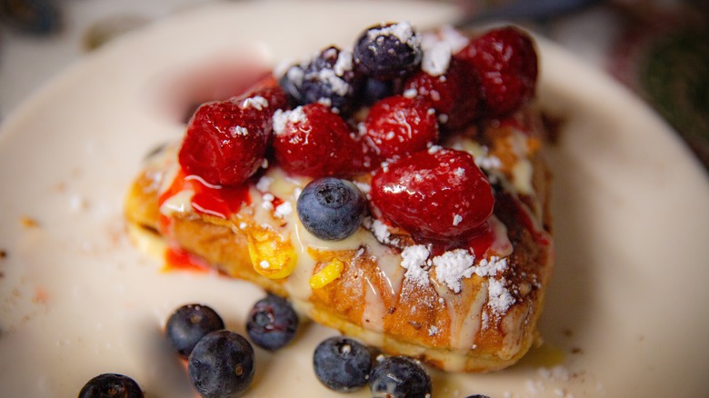 Stuffed French toast with berries and powdered sugar