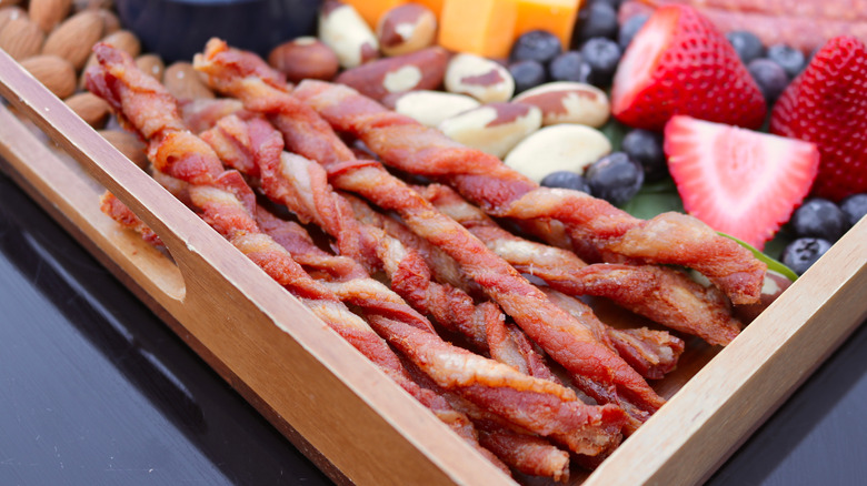 Twisted bacon on charcuterie board