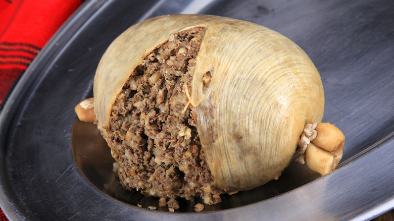 cooked haggis on a pewter platter