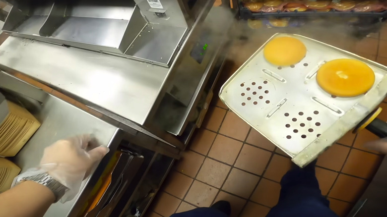 taking steamed buns out of steamer