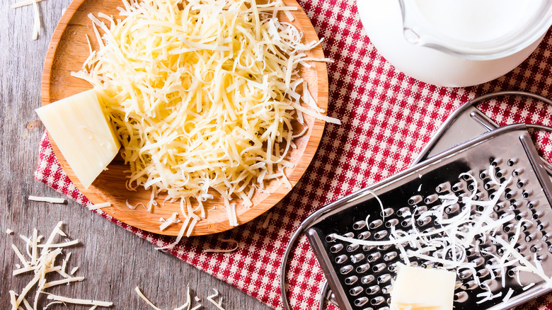 Freshly grated cheese on plate