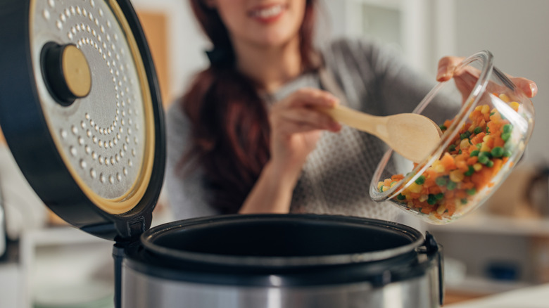 Putting veggies in slow cooker