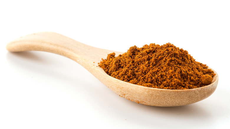 Wooden spoon of paprika