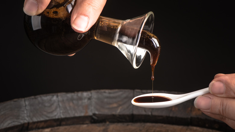 Pouring balsamic vinegar into spoon