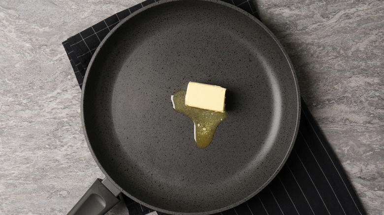Frying pan with melting butter